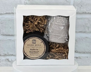 Two piece body care gift set with a barrel molded hand soap and a Bathe in Bourbon scented 8 oz soy candle. Gift wrapped in a white box.