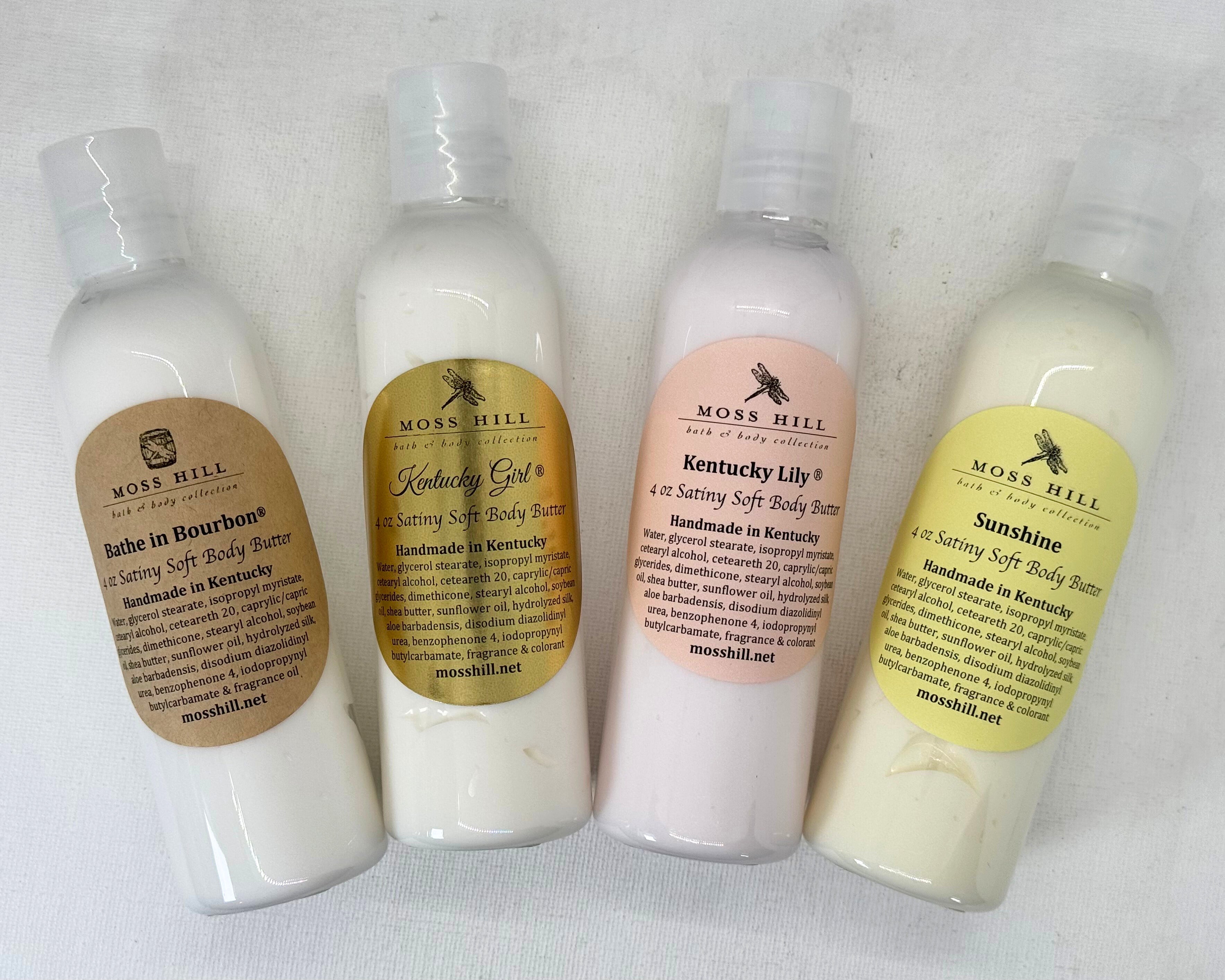 handmade body butter collection in clear bottles with four scent options.