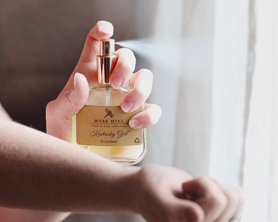 Kentucky Girl Spray Perfume Being Misted Onto A Woman's Arm