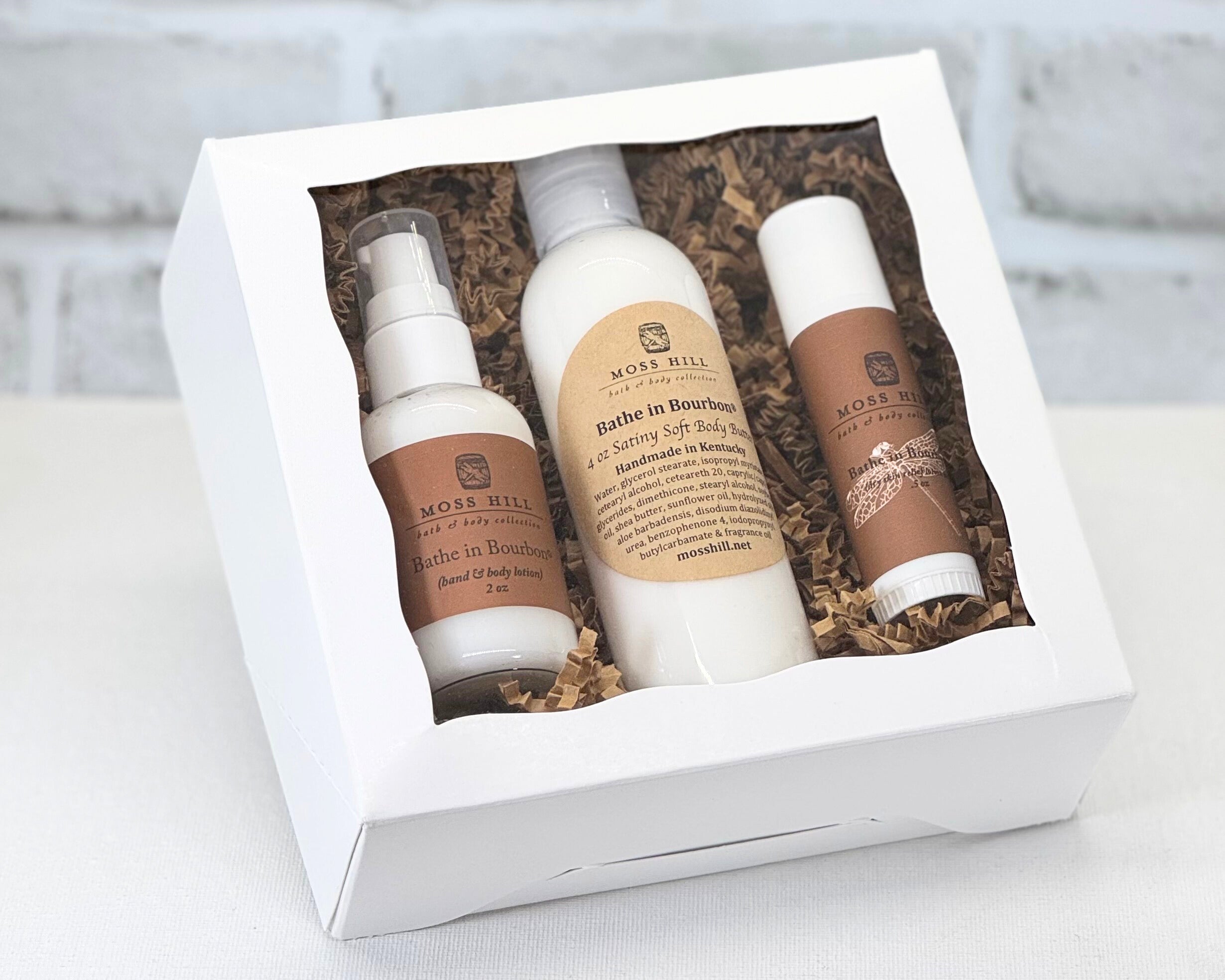 Moisturizing three piece body care gift sent in Bathe in Bourbon scent with Dry Skin Relief, Hand and Body Lotion, and Satiny Soft Body Butter