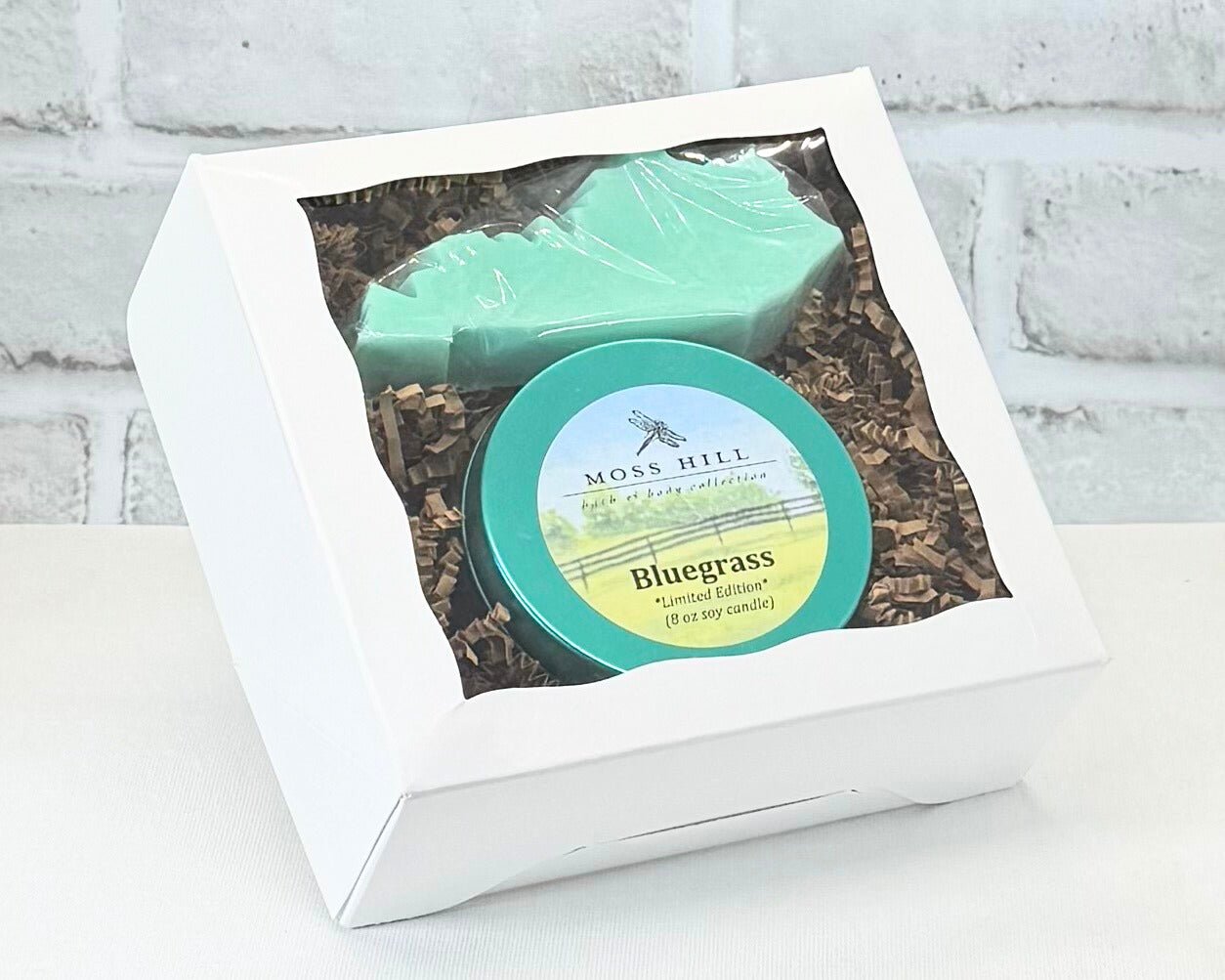 Two piece gift box set in the scent Bluegrass. It comes with a handmade soap in the shape of Kentucky with a 8oz soy candle.