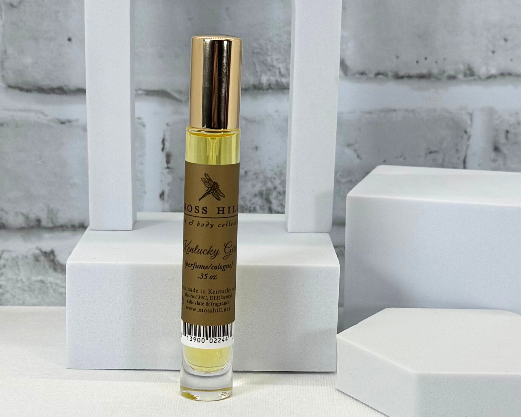 Handmade Kentucky Girl perfume spritzer, travel size bottle styled on a white background by Moss Hill Bath & Body Collection.