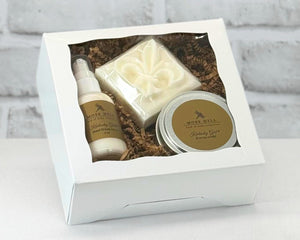 3 piece gift box set with bar soap, hand a body lotion, and a 6 oz soy candle in the scent Kentucky Girl.