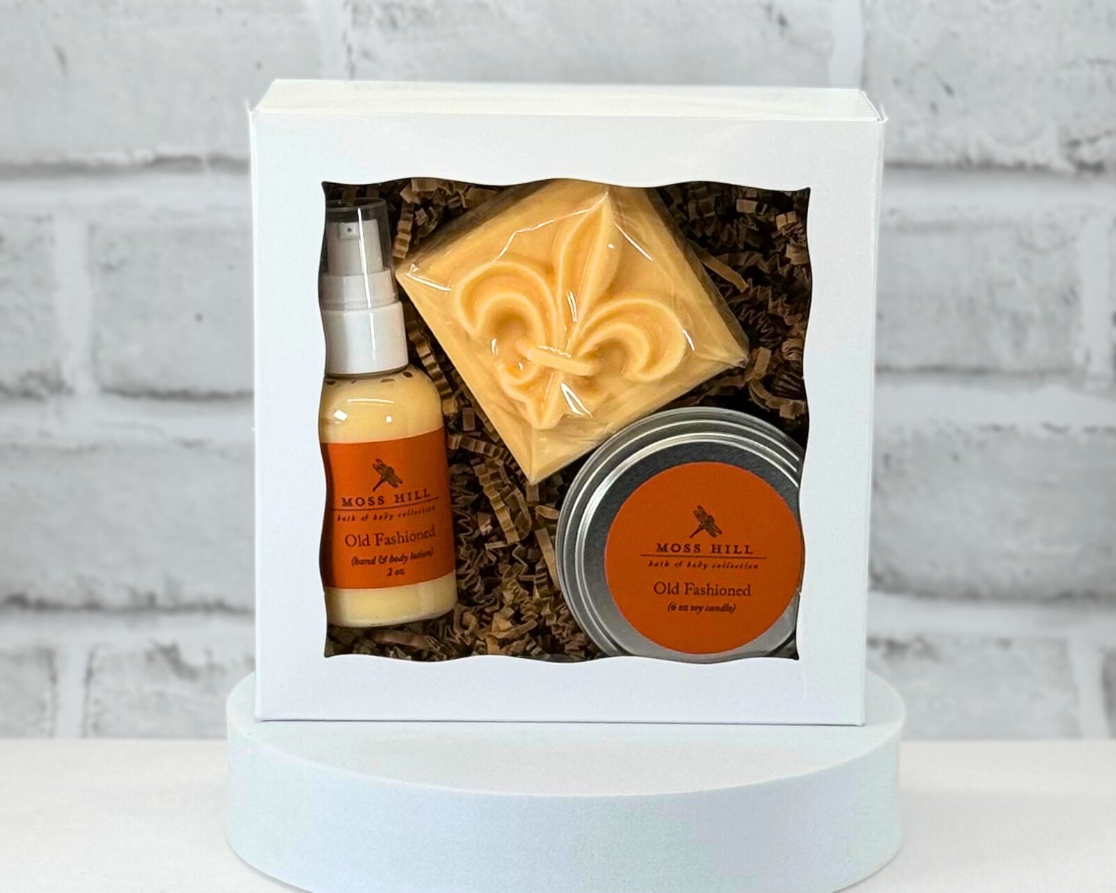 3 piece body care gift box set with bar soap, hand a body lotion, and a 6 oz soy candle in the scent Old Fashioned.