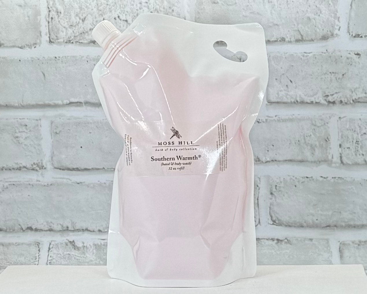 A 32 oz refill of Moss Hill's handmade hand and body wash in the scent Southern Warmth.
