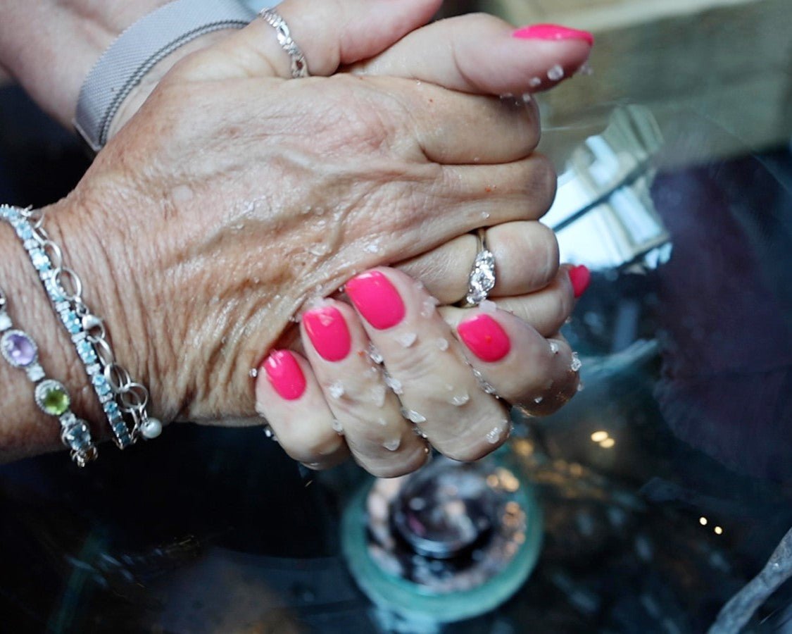 Two hand rubbing together after using the handmade sea salt body scrub by Moss Hill in Louisville, Kentucky
