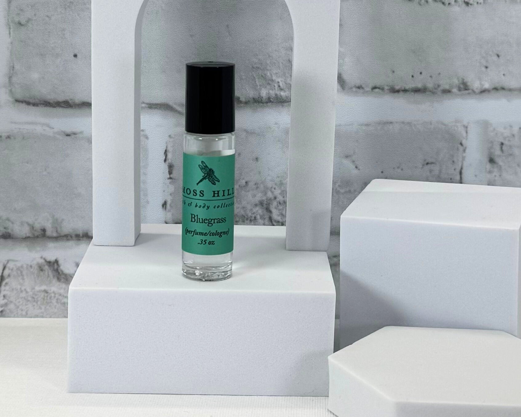 Roll-on perfume in Bluegrass scent, handmade my Moss Hill for a subtle, long-lasting fragrance.