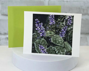 Greeting card with purple flowers on a white background done in watercolor. Representing the Patchouli Mint scent collection by Moss Hill Bath and Body.