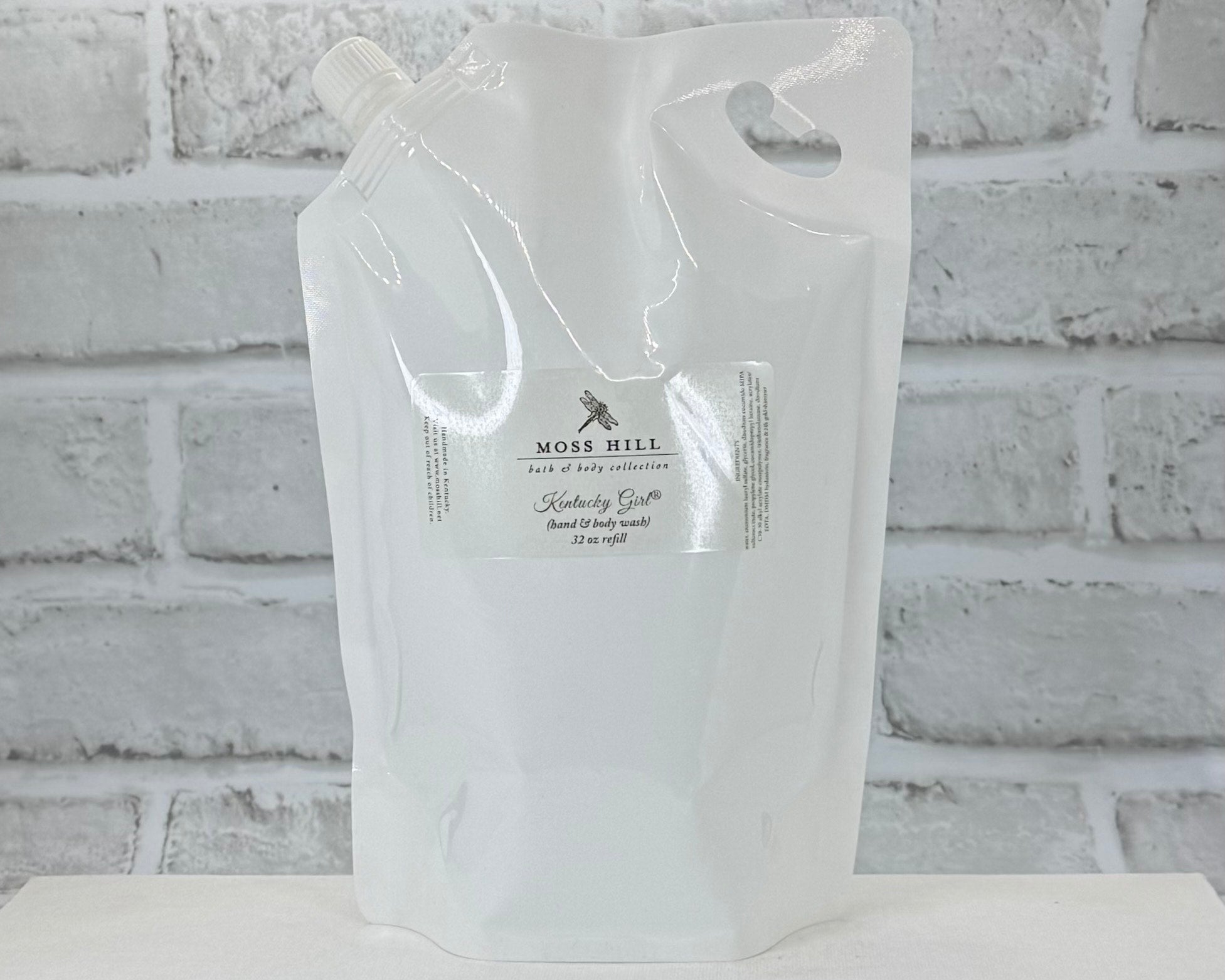 Moss Hill handmade hand and body wash in the scent Kentucky Girl. In a 32oz refill container.