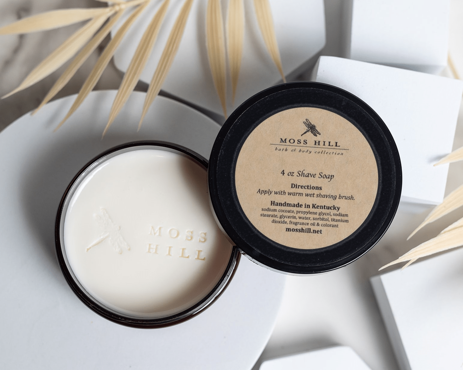 Shave soap in a black can with the moss hill logo that can be customized with your favorite scent.