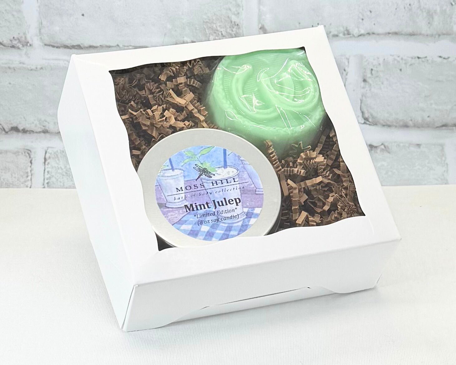 Tow piece body care gift set in the scent Mint Julep. This gift set comes with a handmade soap with horseshoes stamped on the top of it and an 8 oz soy candle.