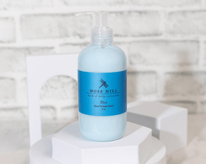 Close up of 8 ounce lotion bottle in the scent blue.