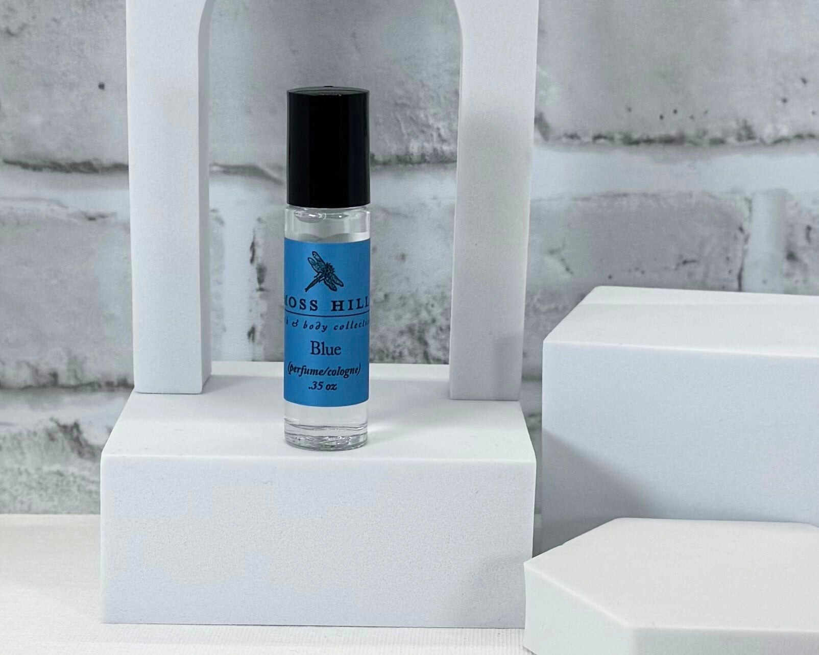 Roll-on perfume, Bluegrass scent by Moss Hill, in glass bottle with long-lasting fragrance base.