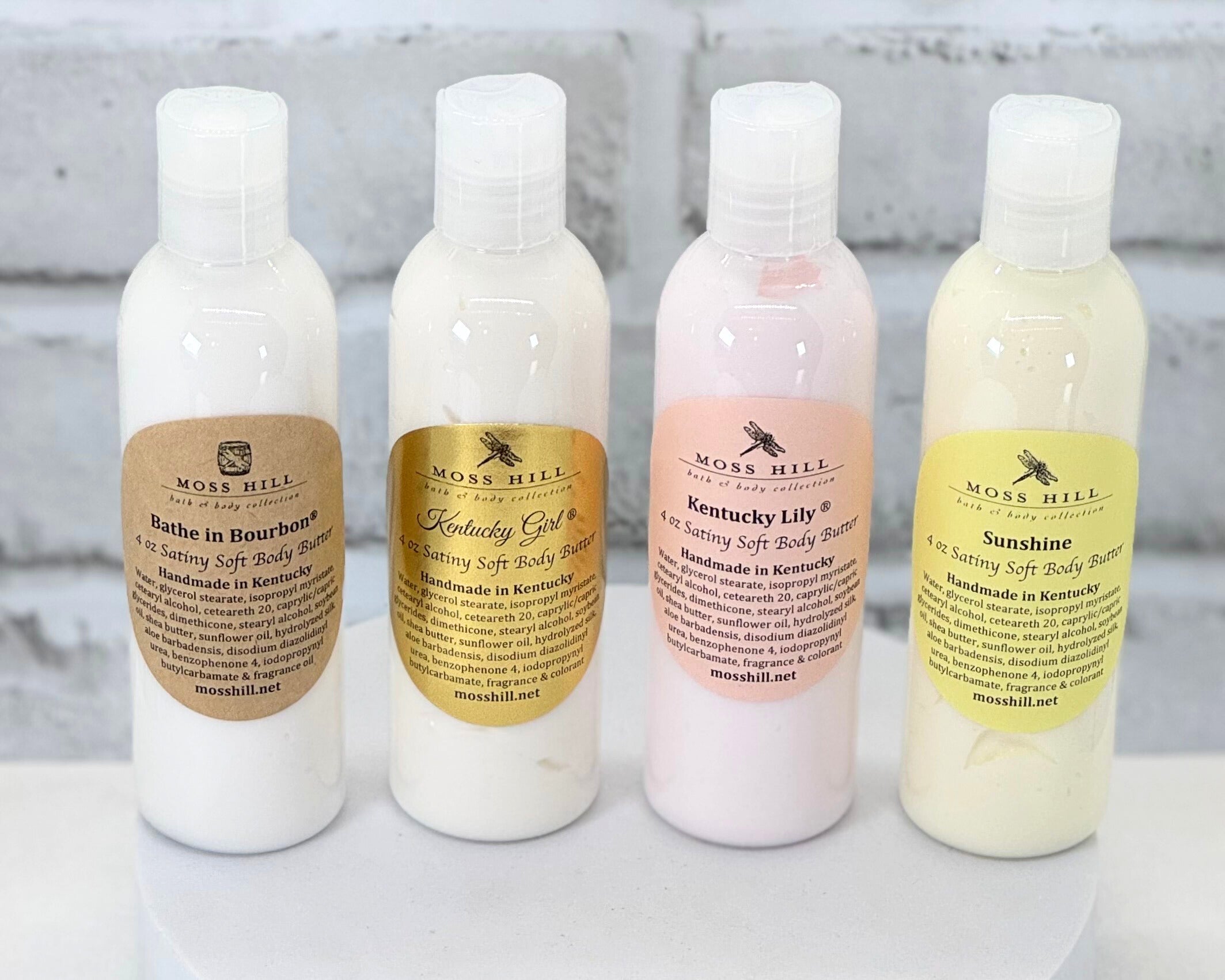 Set of four moisturizing handmade body butter is clear bottles. Shipped from Louisville, KY.