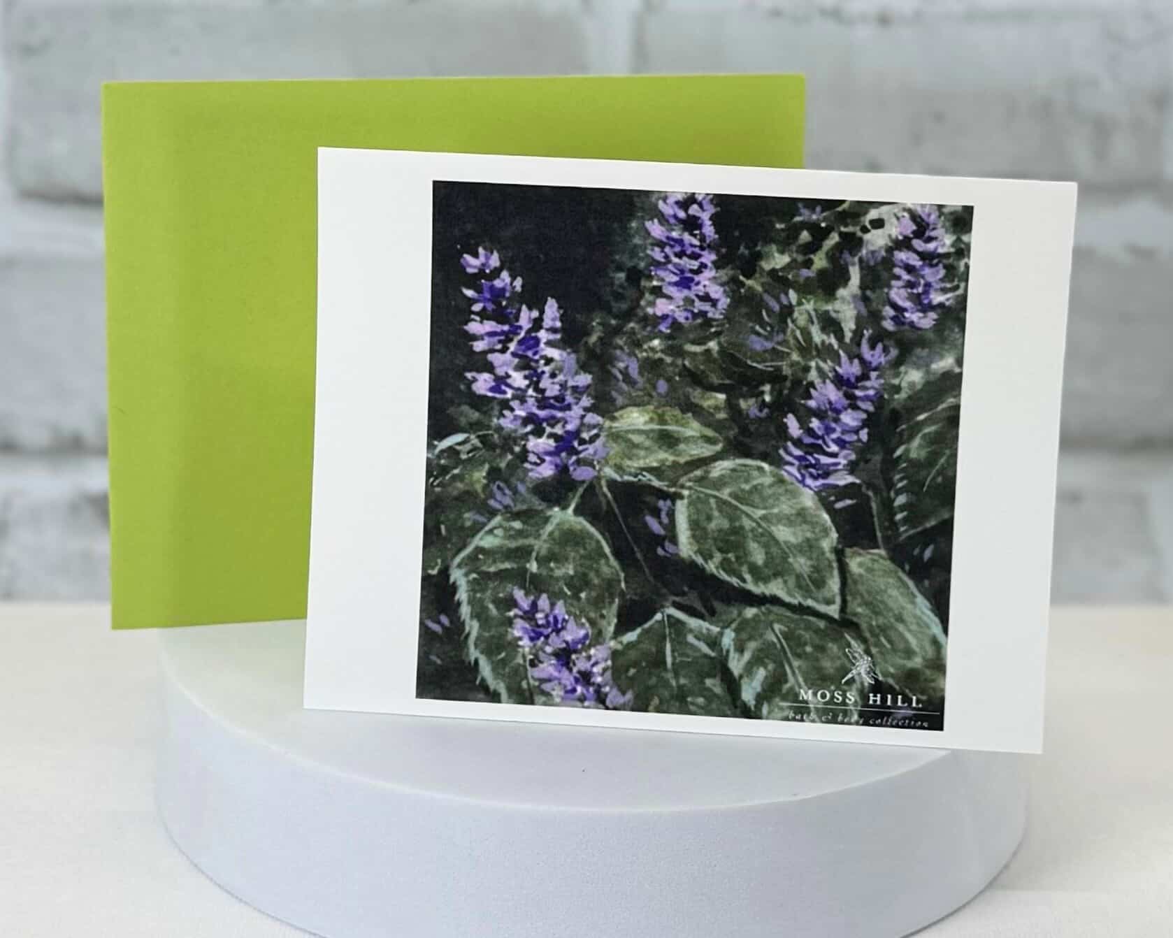 Greeting card with purple flowers on a white background done in watercolor. Representing the Patchouli Mint scent collection by Moss Hill Bath and Body.