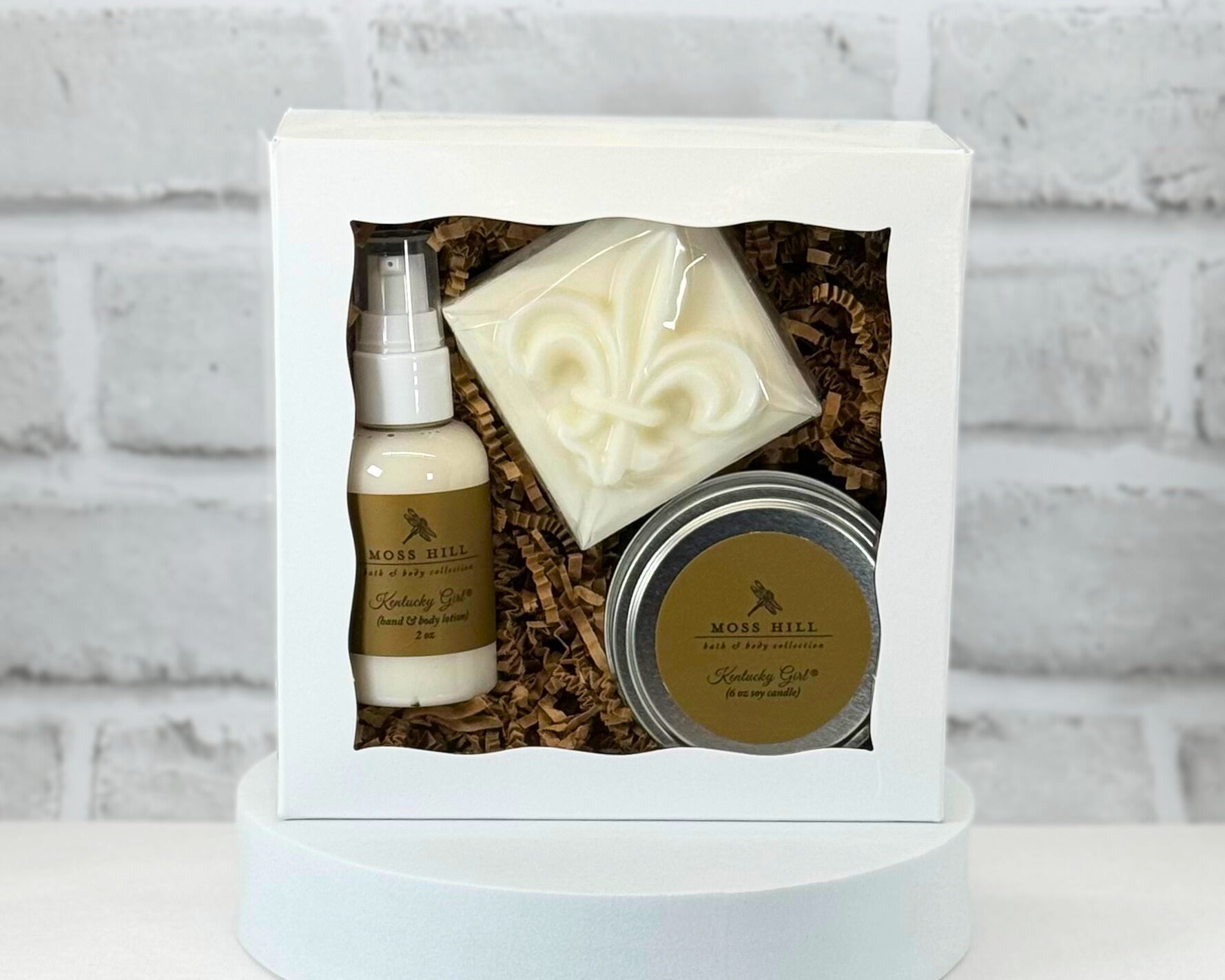 3 piece body care gift box set with bar soap, hand a body lotion, and a 6 oz soy candle in the scent Kentucky Girl