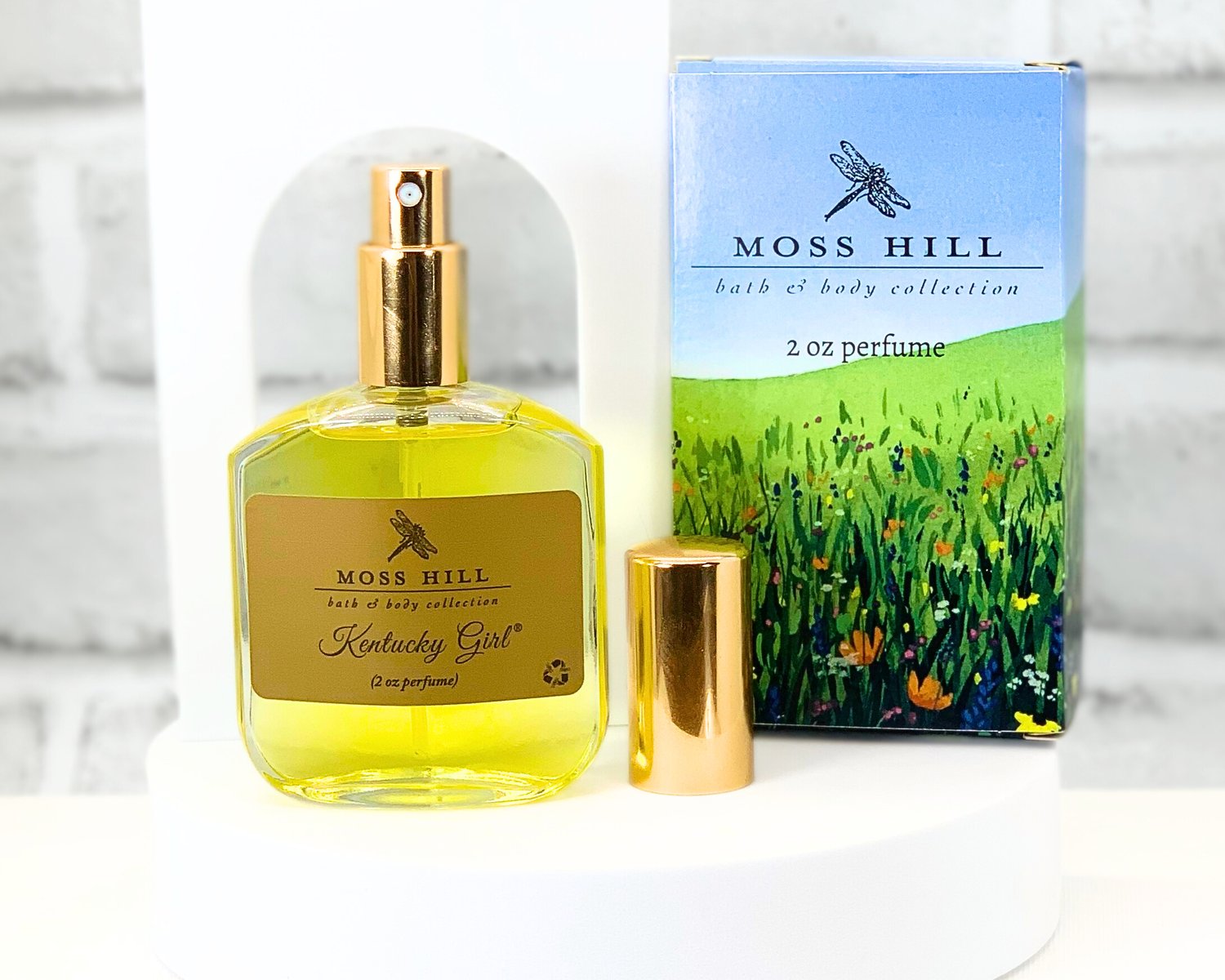 Kentucky Girl glass perfume bottle displayed on a vanity with Moss Hill branding
